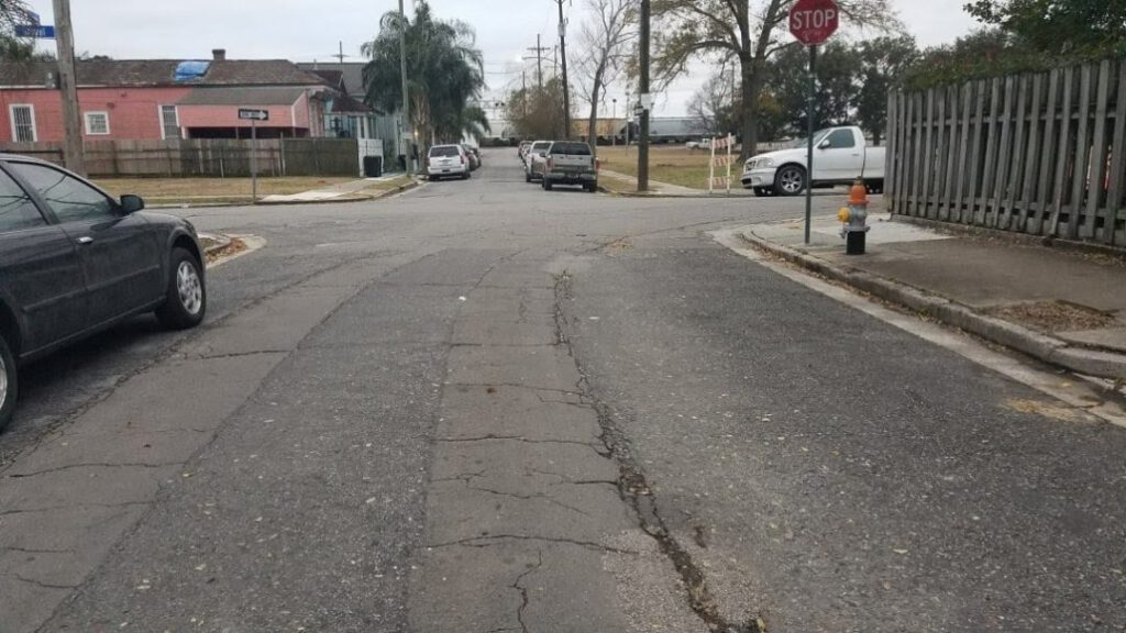 Cracks in France Street, facing toward the river as cracks turn up Royal Street, just as the former Desire Line would have. Photographs taken from The Streetcars of New Orleans by Louis C. Hennick, © Louis C. Hennick, used by permission of the publisher, Pelican Publishing.
